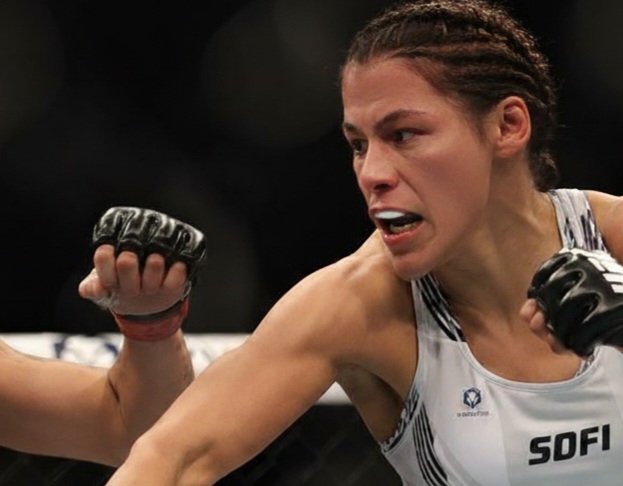 Indian athletes showcasing strength and skill in a combat sports competition organized by the Sports Development Federation of India (SDFI).